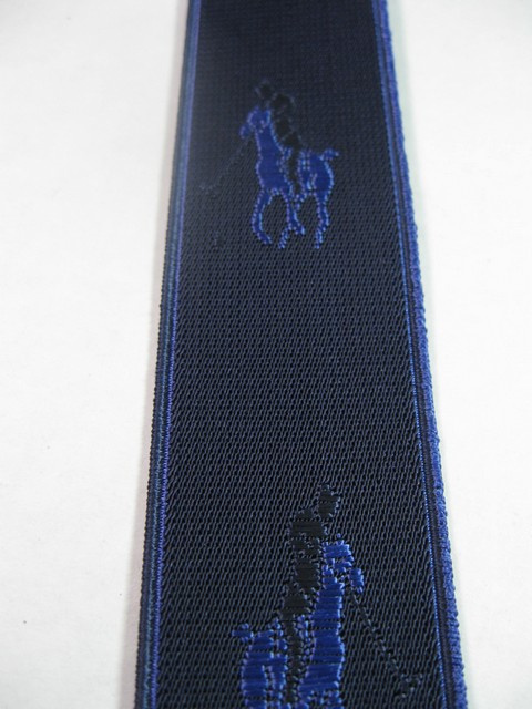 HORSE WITH RIDER WITH ROYAL BLUE AND BLACK ON NAVY BLUE BACKGROUND. "Y" STYLE 1 1/3" X 48" DELUXE SUSPENDERS.WITH GOLD GRIPS AND 2 LENGTH ADUSTERS YD-POL76B48#107g